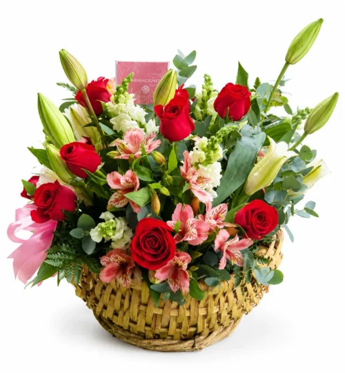 Canasta con rosas, girasoles lirios y flores de complemento